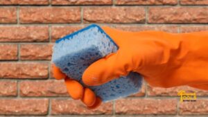 Wet-the-brick-with-a-sponge-